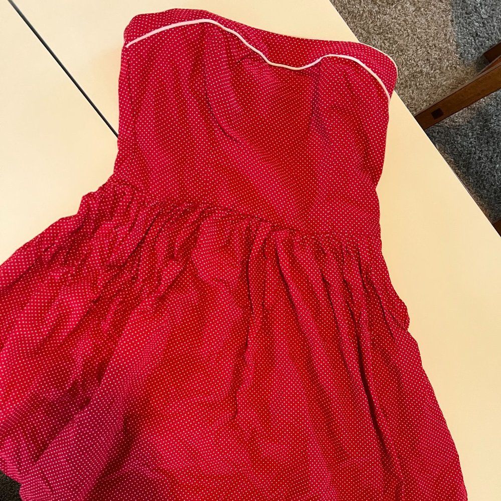 sleeveless red dress with scalloped lace edge